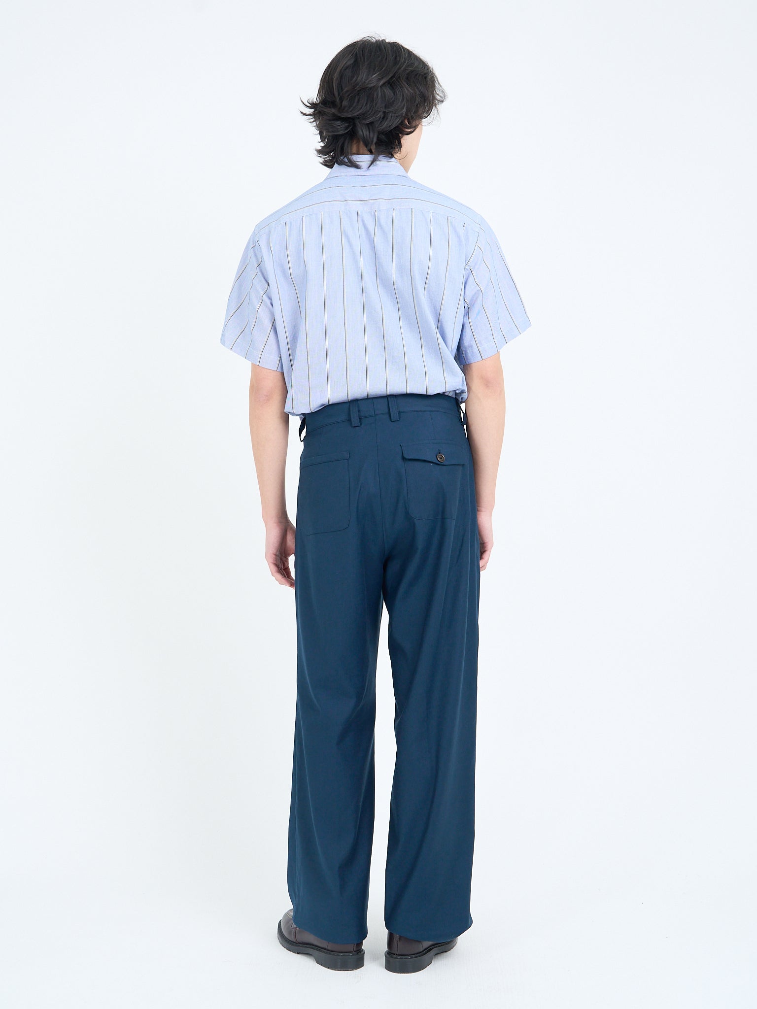 Navy wide-leg trousers with rear patch pockets, back view