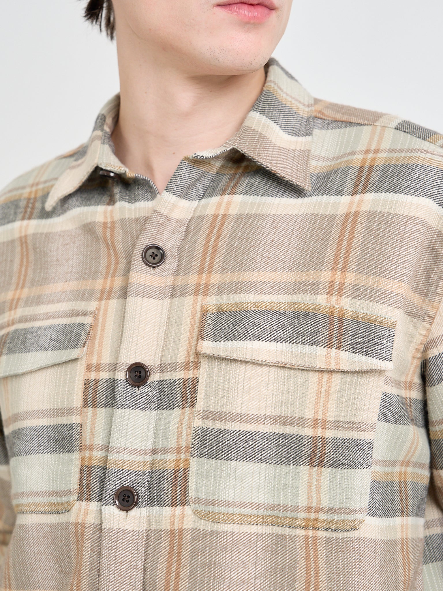 Close up collar shot of model wearing an Oliver Spencer Men&#39;s Beige Brushed Cotton Check Overshirt