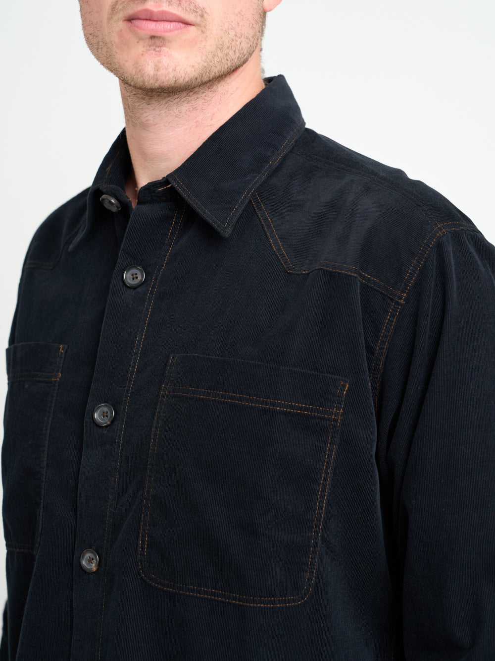 Close up shot of model wearing Oliver Spencer Men&#39;s Black Midweight Cotton Corduroy Western Shirt