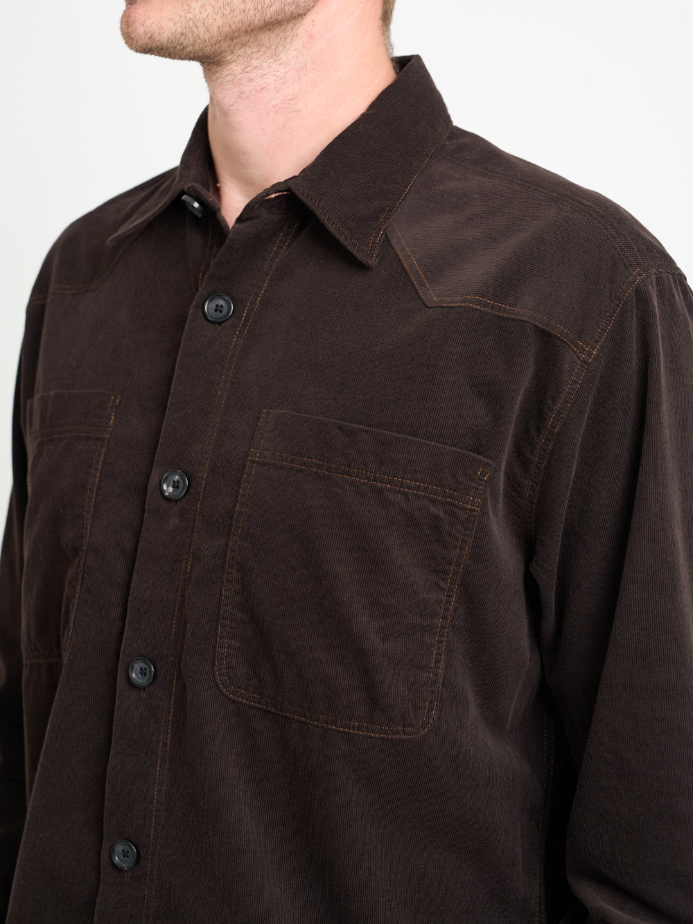 Close up shot of model wearing Oliver Spencer Men&#39;s Brown Midweight Cotton Corduroy Western Shirt