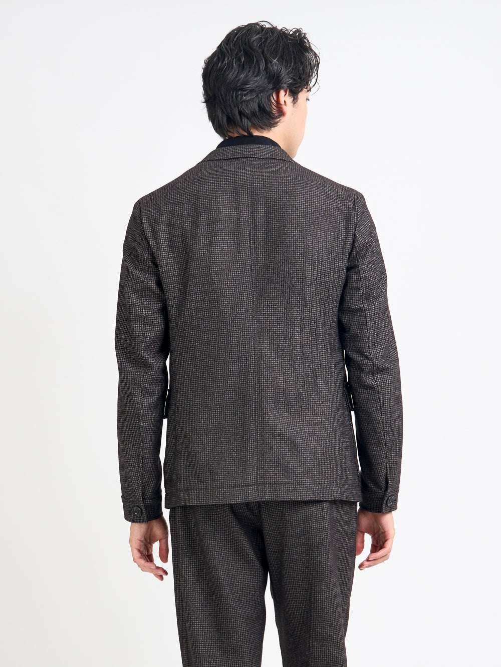 Close up back shot of model wearing Oliver Spencer Men's Unstructured Notch Lapel Brown Jacket