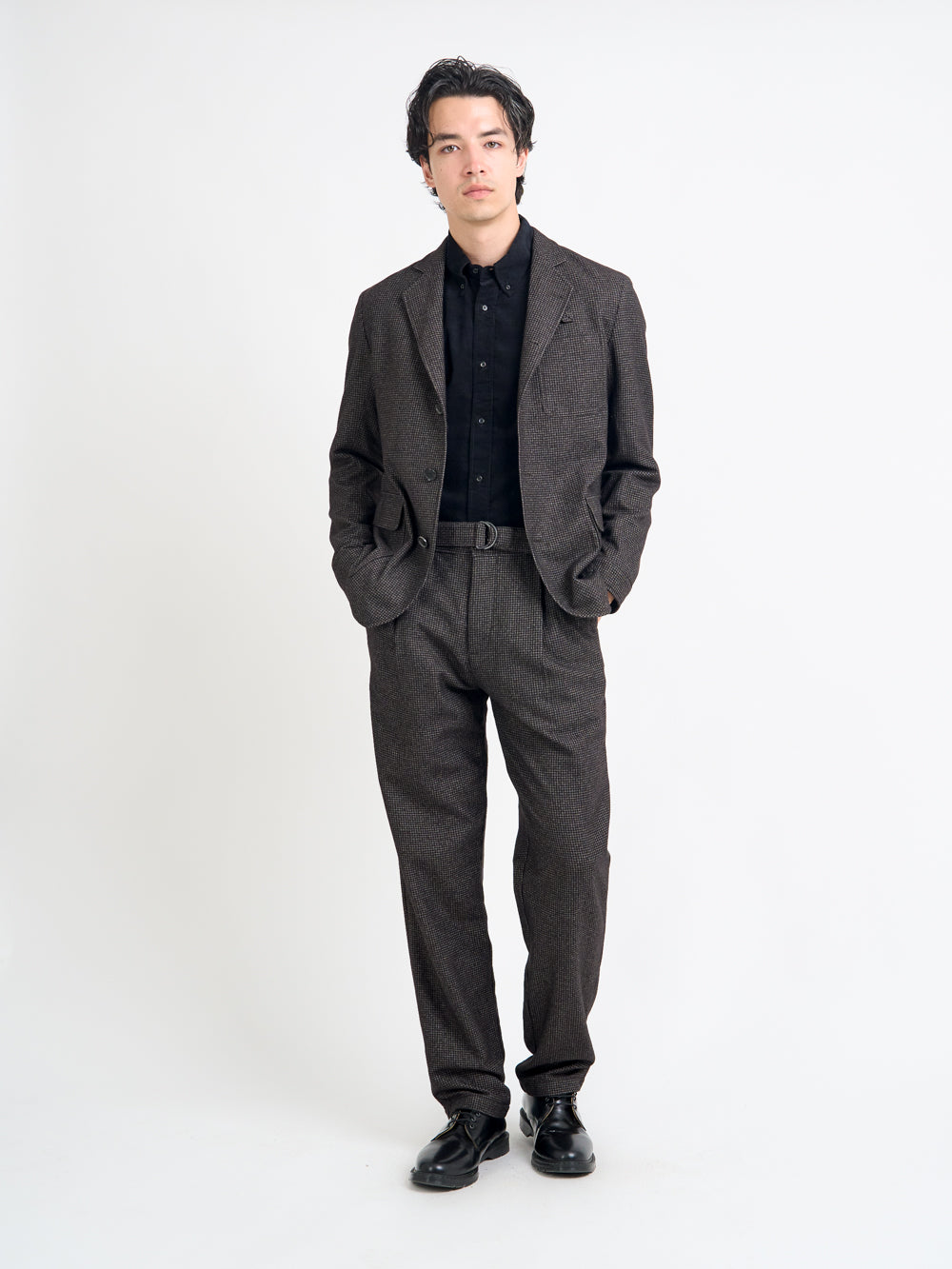 Model wearing Oliver Spencer Men's Unstructured Notch Lapel Brown Jacket