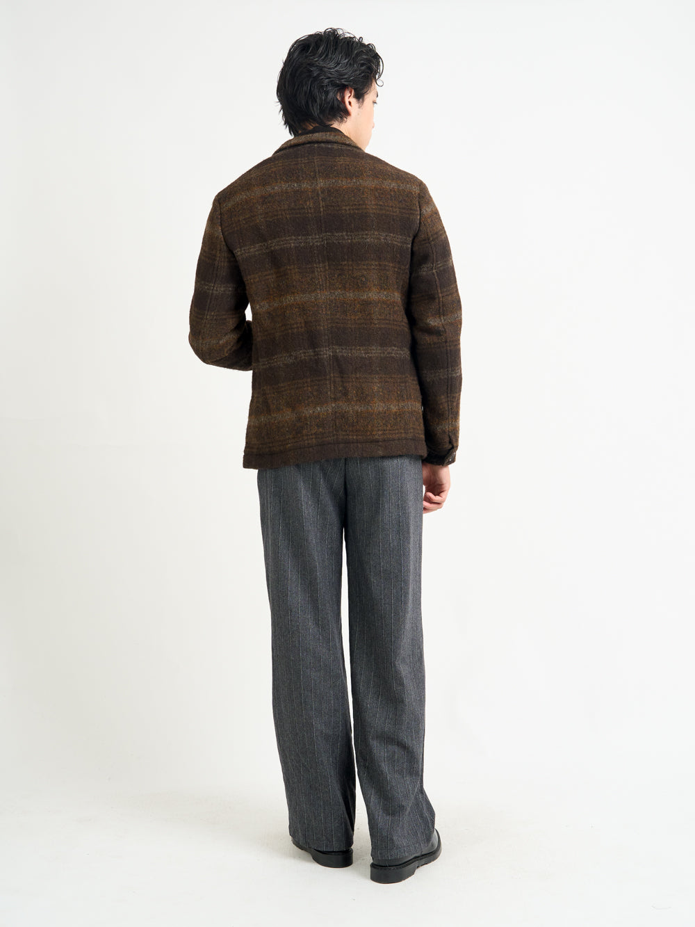 Back shot of model wearing Oliver Spencer Men's Unstructured Notch Lapel Brown Plaid Jacket