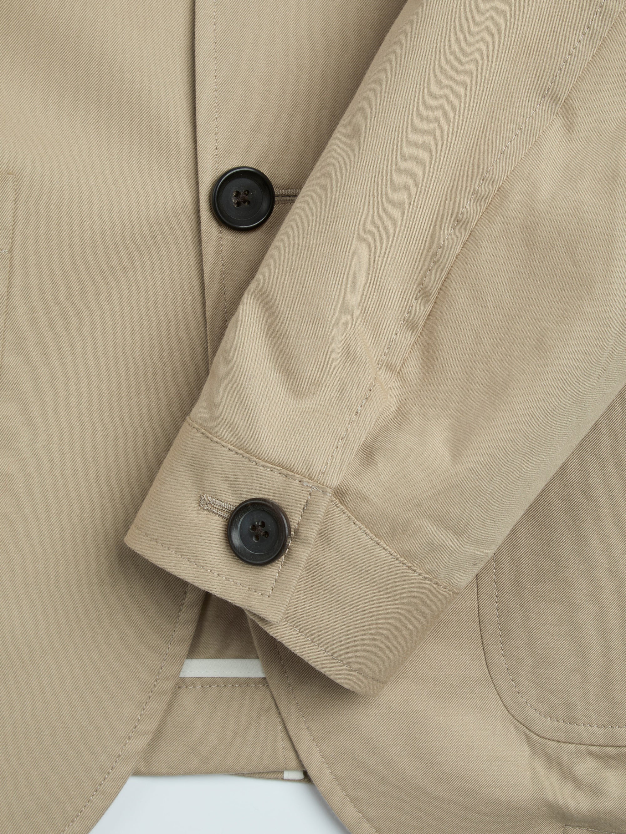 Detailed cuff shot of Oliver Spencer Men's Unstructured Notch Lapel Beige Cotton Jacket