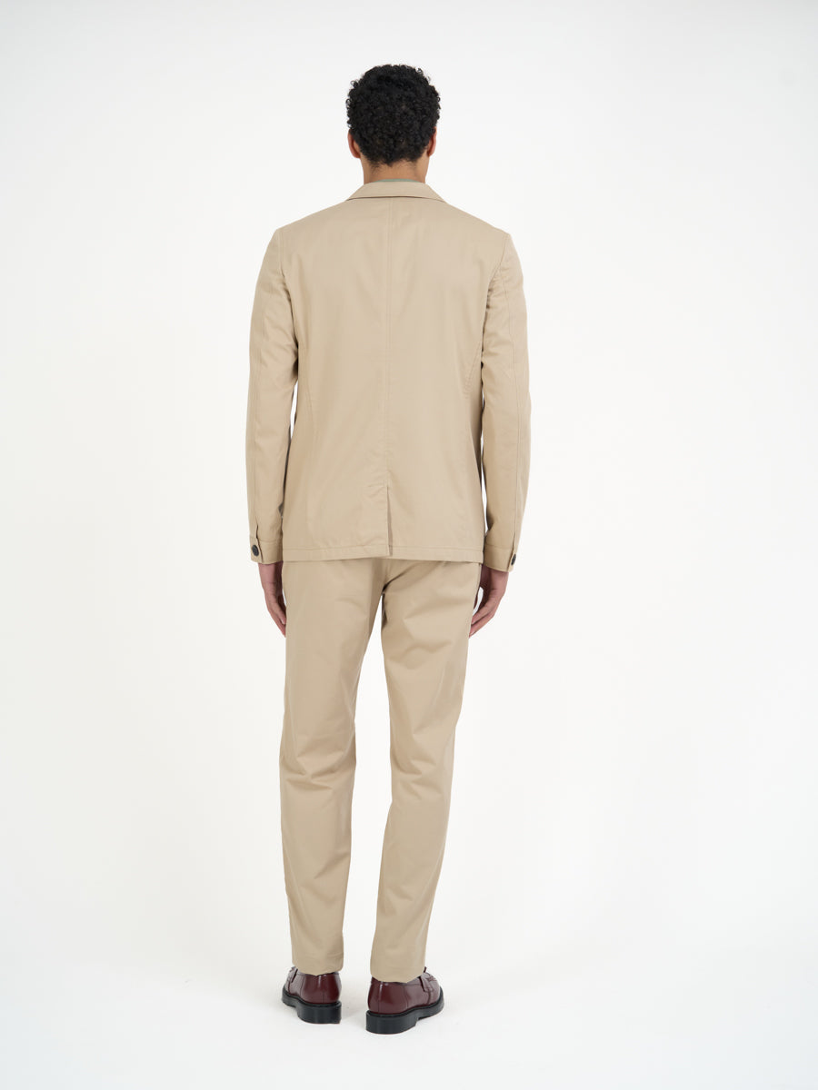 Back shot of model wearing Oliver Spencer Men's Unstructured Notch Lapel Beige Cotton Jacket
