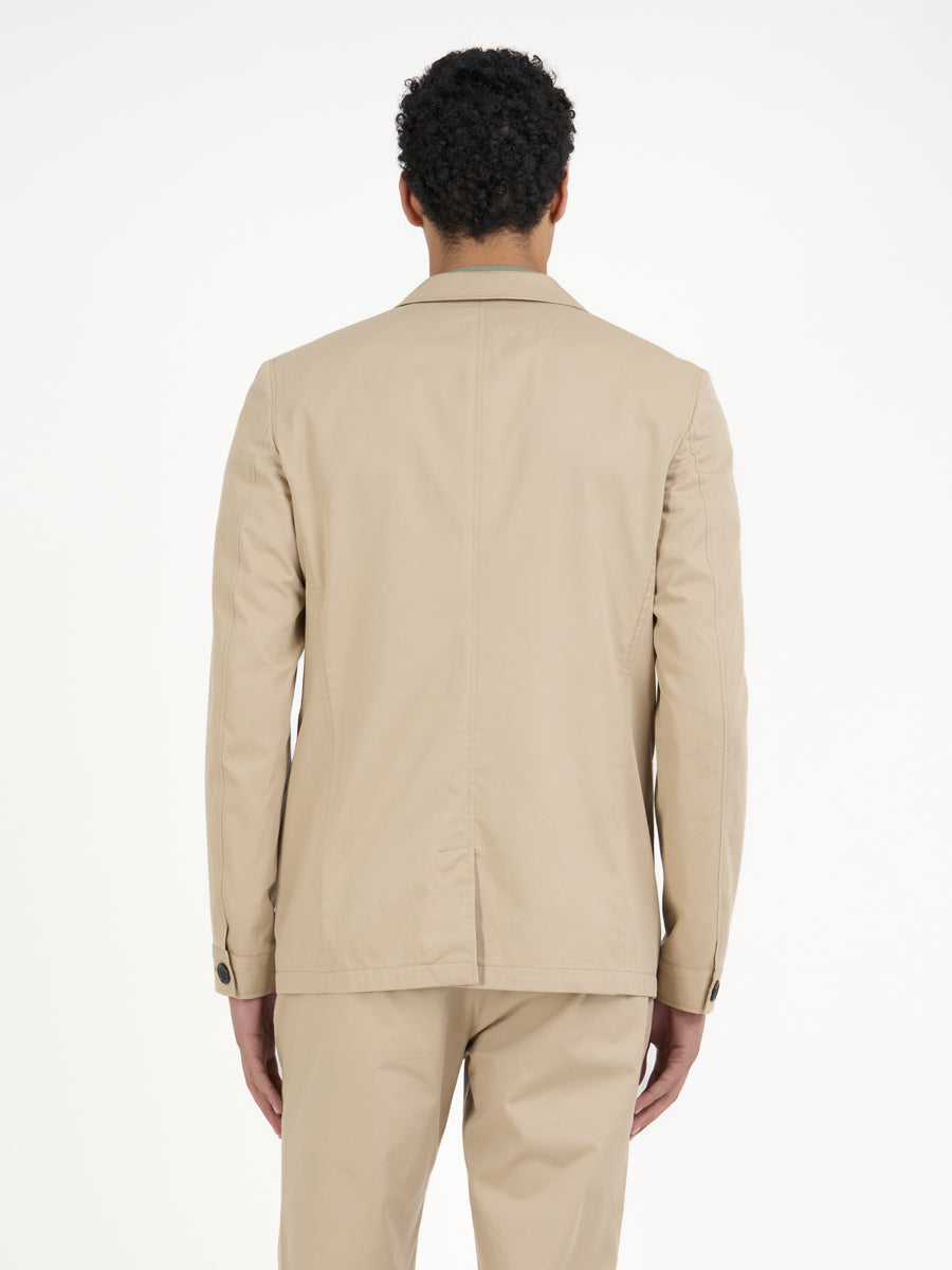 Detailed back shot of model wearing Oliver Spencer Men's Unstructured Notch Lapel Beige Cotton Jacket