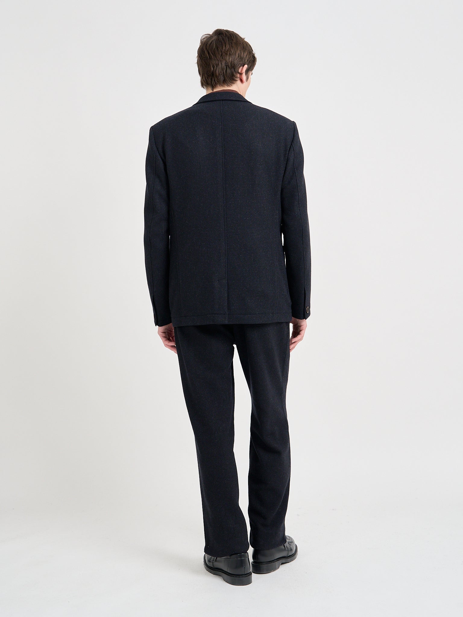 Back shot of model wearing Oliver Spencer Men's Black Wool Single-Breasted Black Jacket