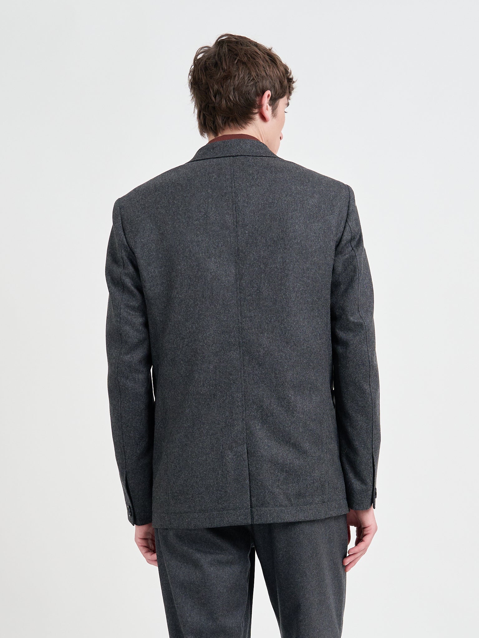 Close up back shot of model wearing Oliver Spencer Men's Charcoal Grey Wool Single-Breasted Jacket 