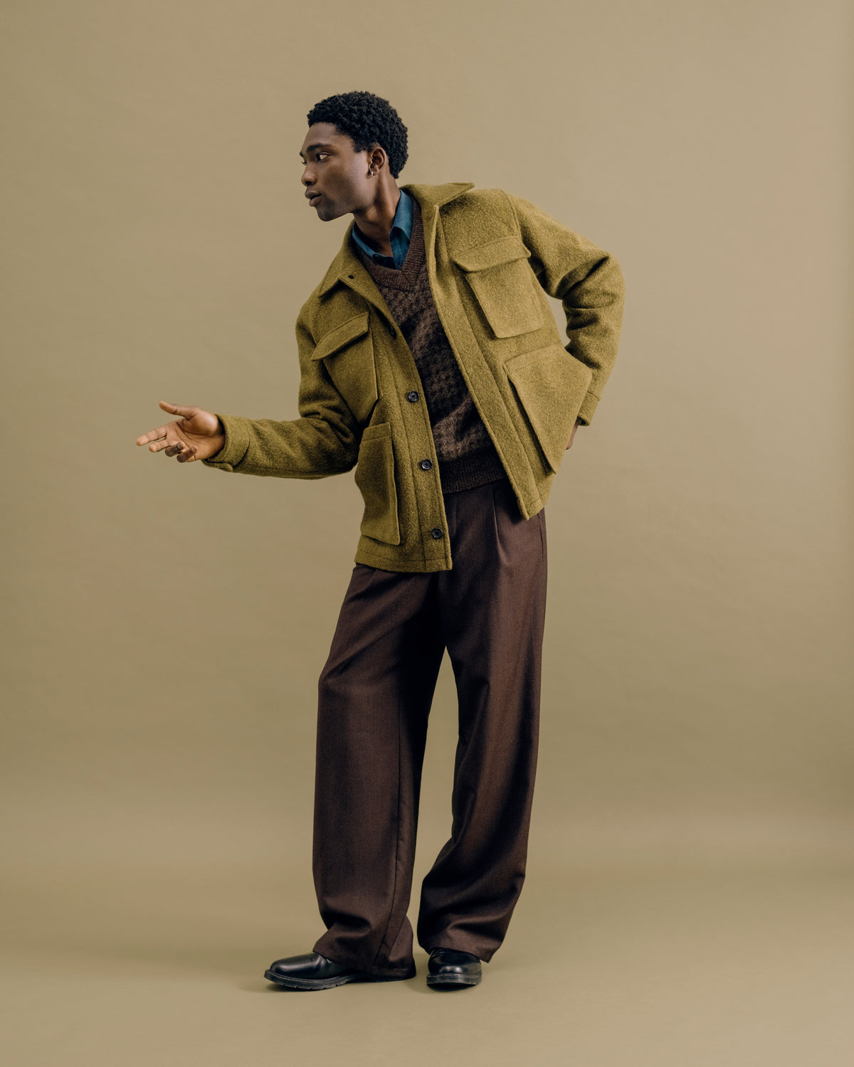 A moss green Heath field jacket with a houndstooth Graves vest and chestnut flannel Orsman trousers
